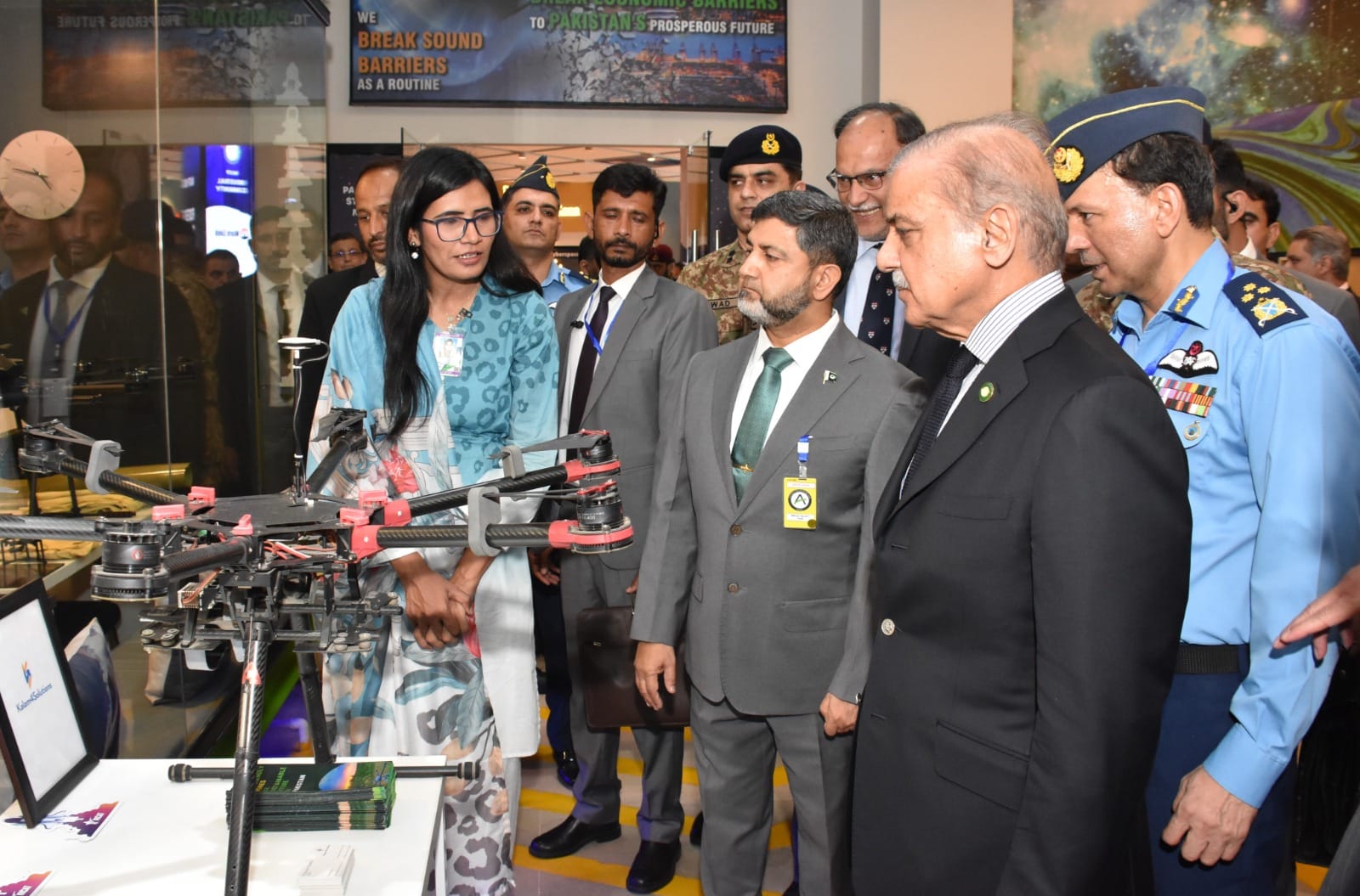 Prime Minister Shehbaz Sharif visiting the NICAT stand at an exhibition, viewing a startup's drone